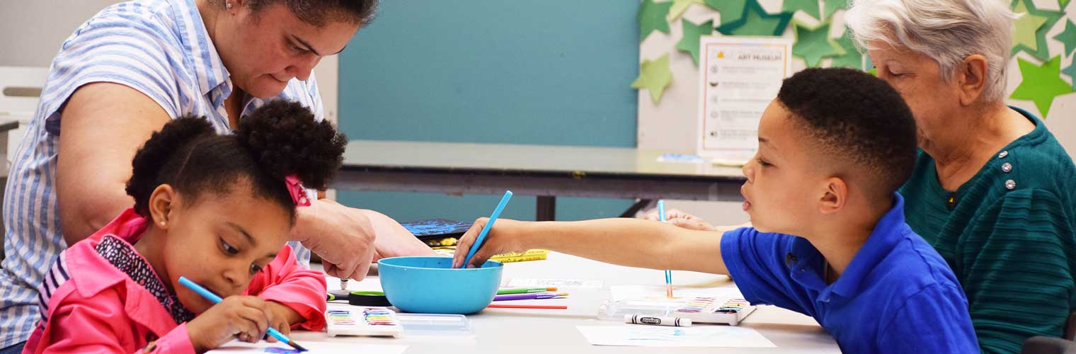 family creating art with young kids