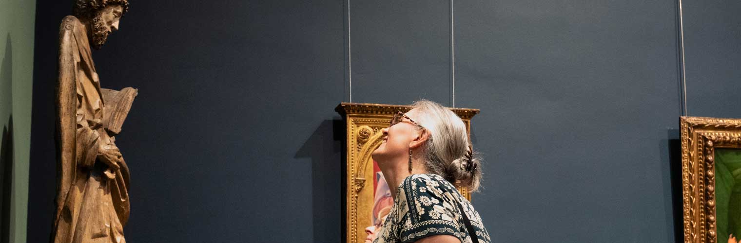 woman looking at a sculpture