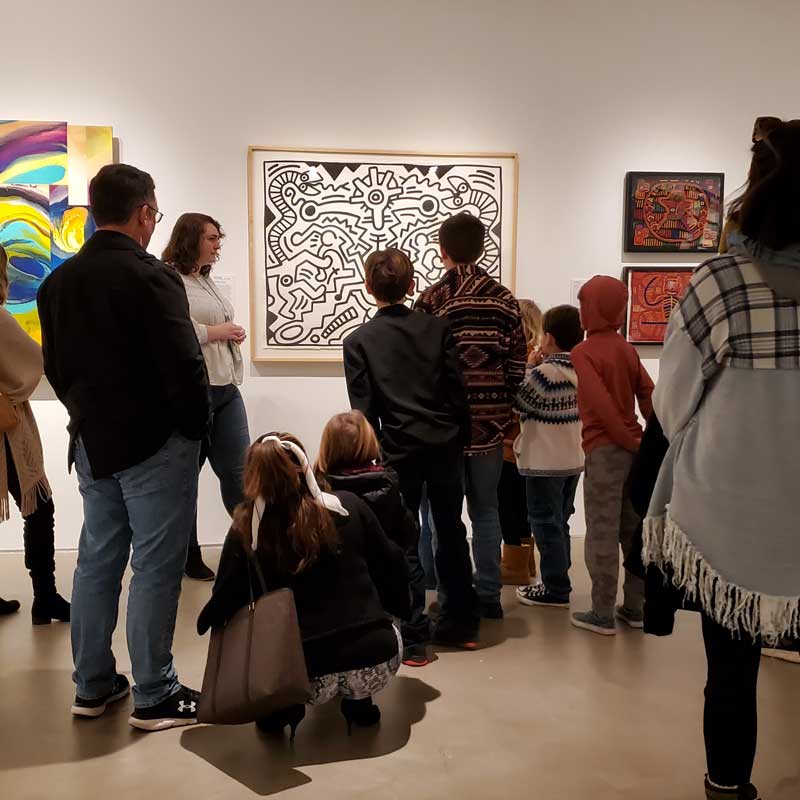 a group of people admiring modern art